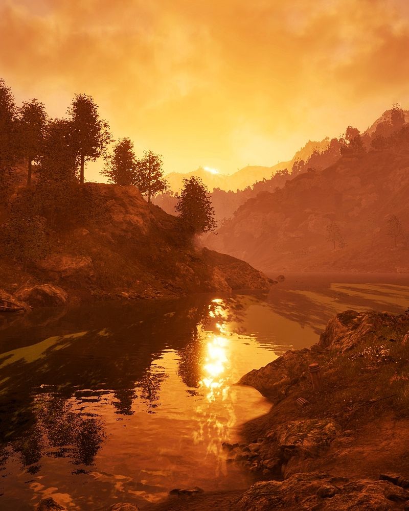 A screenshot of Elder Scrolls Oblivion Remastered. It's a setting sun descending over lakes and trees. The sky is a deep orange.
