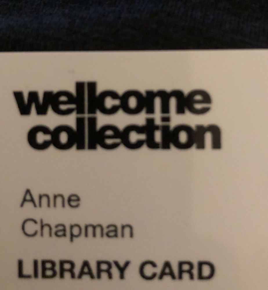 Photo of part of a white library card. Black text reads: wellcome collection Anne Chapman library card