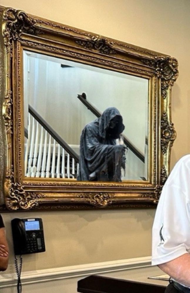 The death is seen in a mirror 