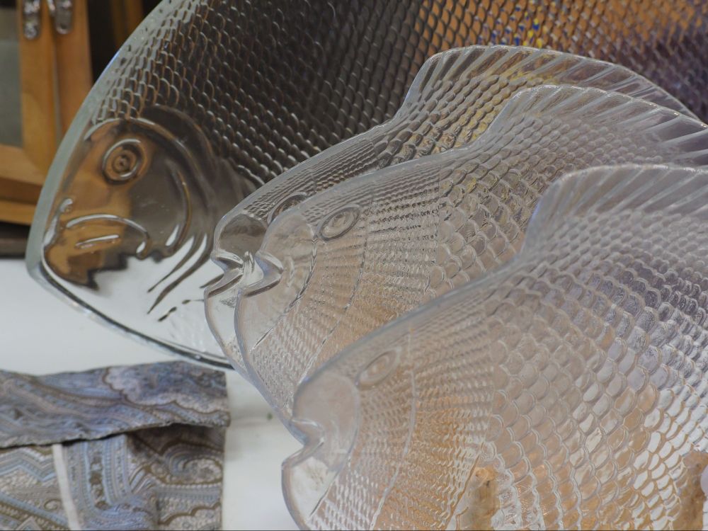 A school of glass fish platters.