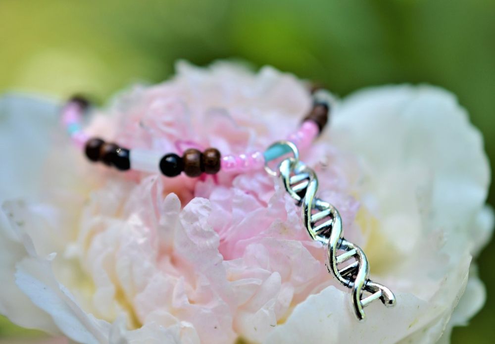 Inclusive transgender color beaded bracelet with DNA charm focal point.