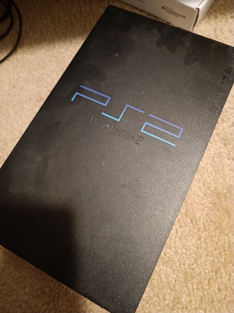 a picture of a PlayStation 2 scph-50001 ("fat PS2") on my floor