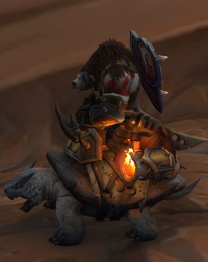 A screenshot from World of Warcraft, showing a close-up of a Tauren Warrior riding the 
Savage Alabaster Battle Turtle mount