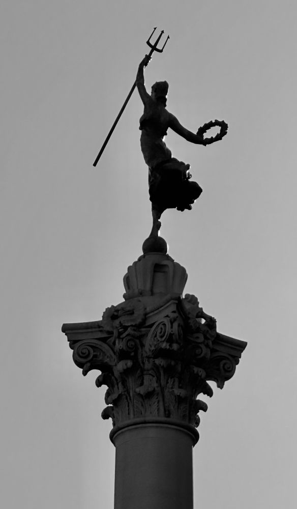 BW photo of the top of Dewey Monument 'Goddess of Victory' holding a trident and wreath.