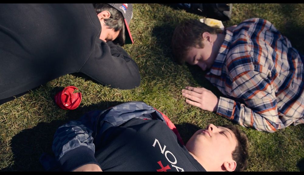 Kids sleeping on the grass