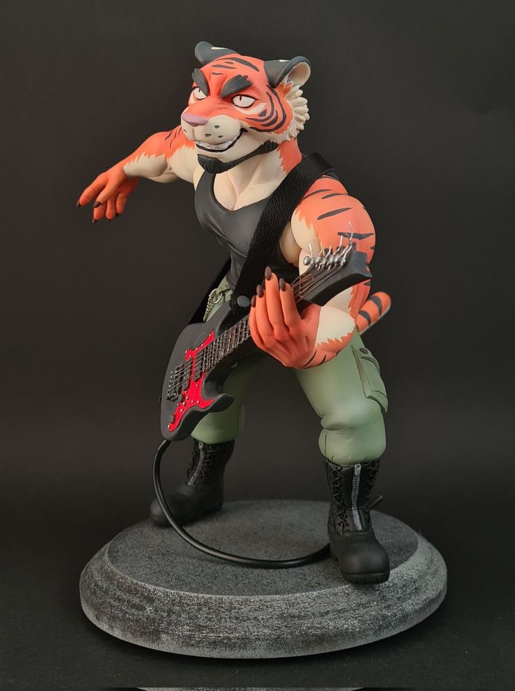 Scupture of a male anthro tiger playing guitar