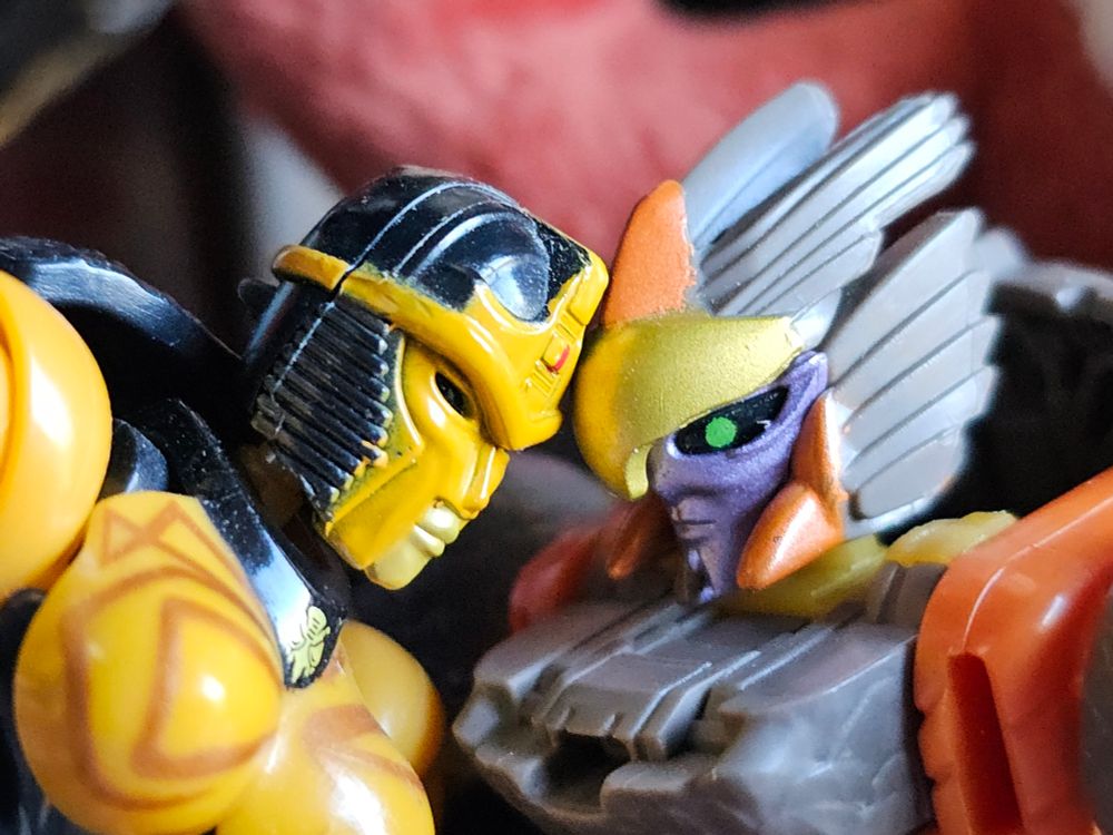 Blackarachnia and Airazor tenderly (?) touching foreheads together