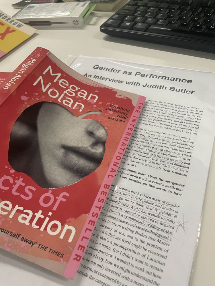 Copy of novel Acts of Desperation by Megan Nolan lying on top of a printed interview with Judith Butler entitled Gender as Performance from a copy of Radical Philosophy journal, with some text underlined and pencil markings on side.