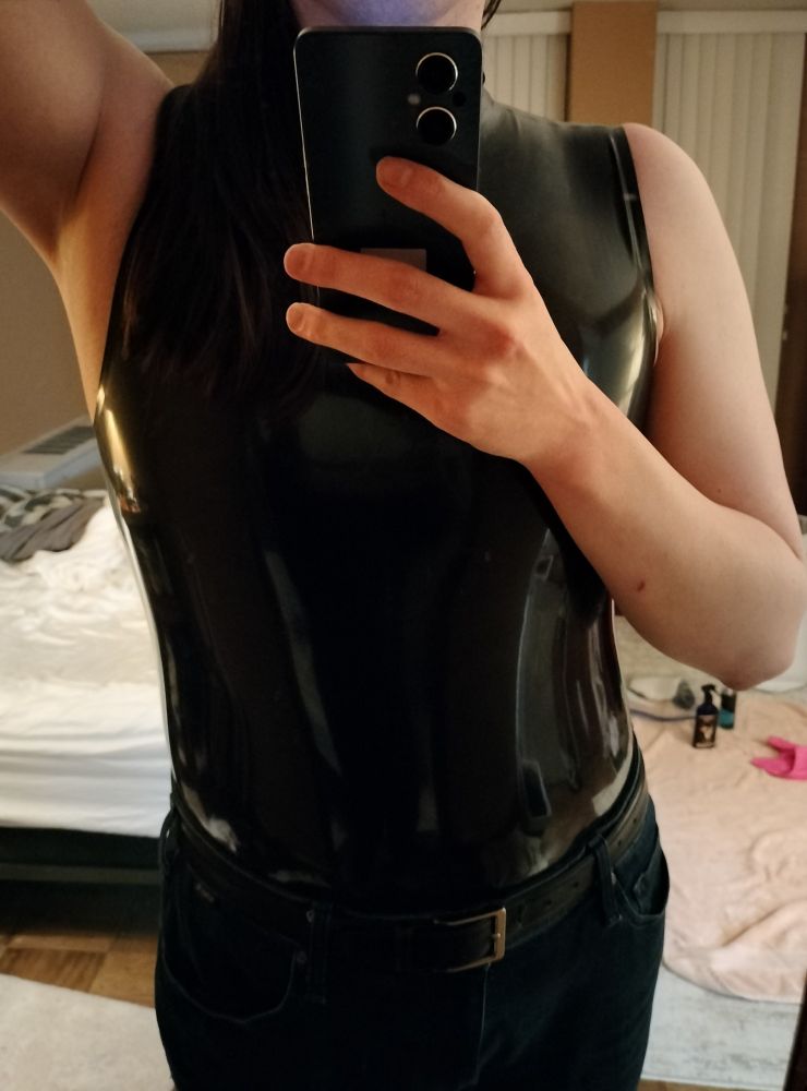 Self-photo of me in jeans and a sleeveless latex bodysuit