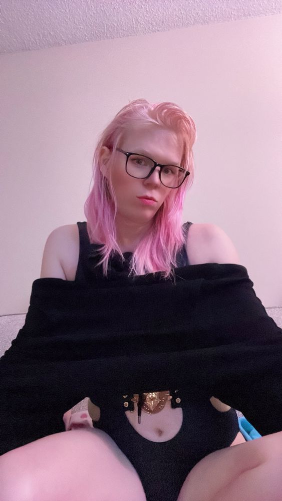 me sitting in my bodysuit and sweater pouting on the couch