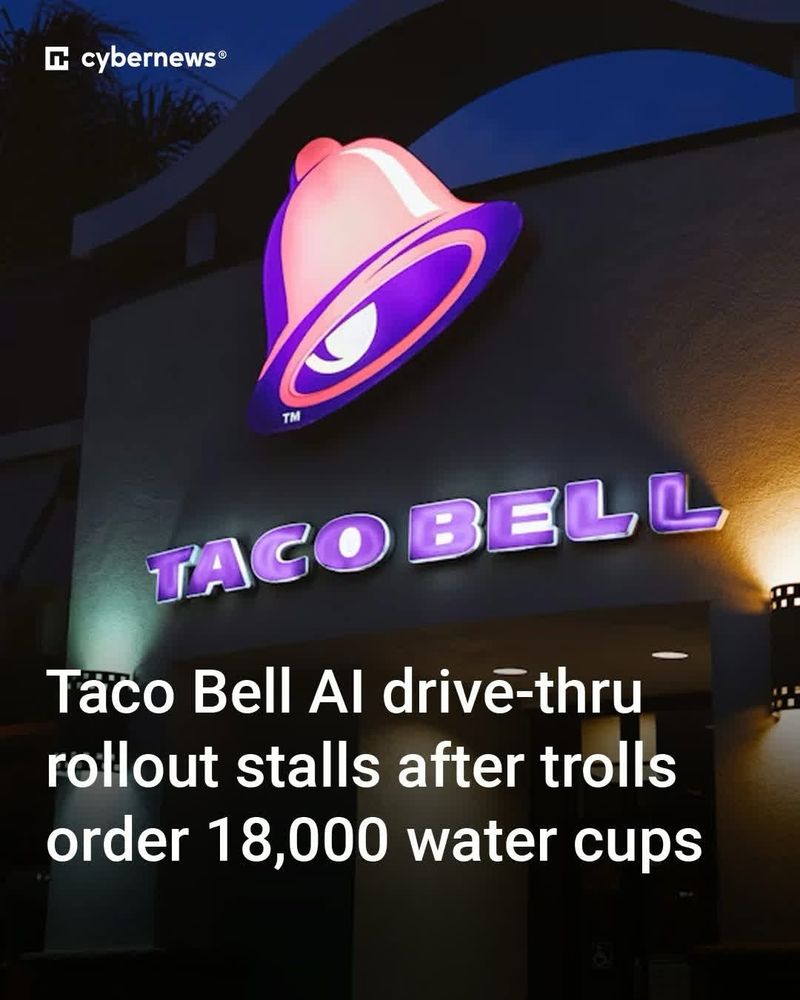 Pic: Taco Bell neon sign at night Text: Taco Bell AI drive thru rollout stalls after trolls order 18,000 water cups Source: CyberNews