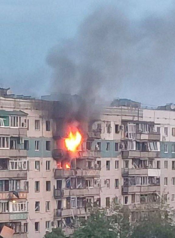 Residential building with upper floors on fire