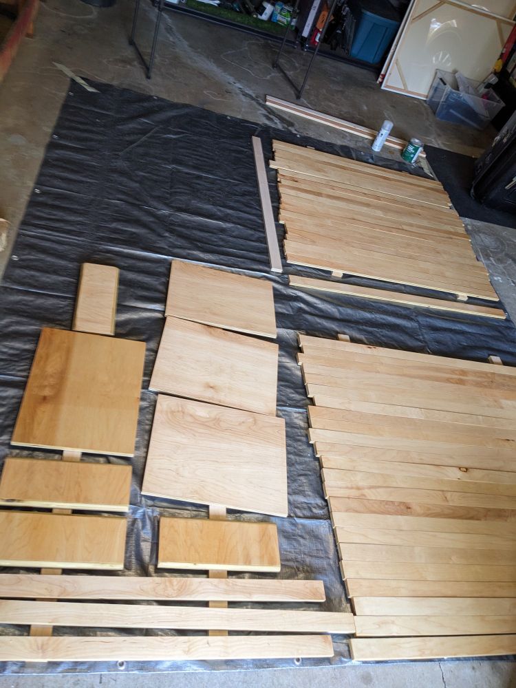 Many pieces of wood laid out on the ground