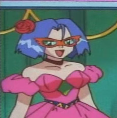 James Rocket from pokemon wearing a dress with their shoulders and neckline fully visible.