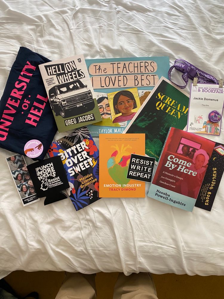 Display of various books and merch from the AWP conference