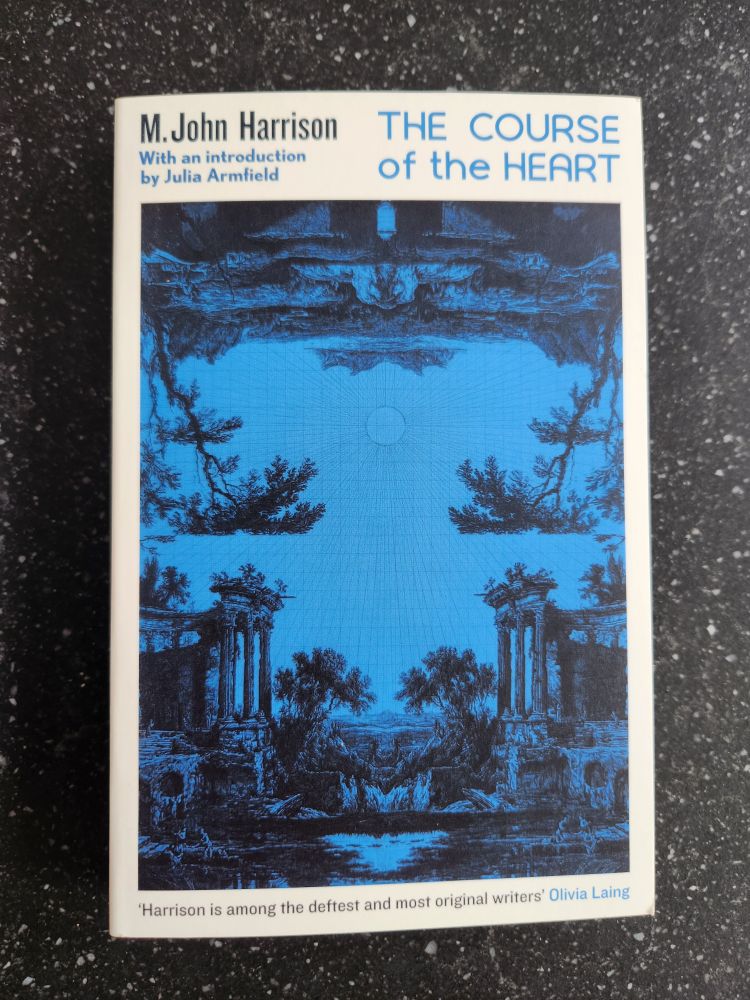 Book cover with blue motiff and a sun in the centre of the world