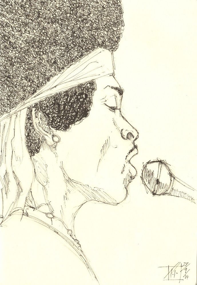 profile of a man in Afro with a headband, menacing a microphone