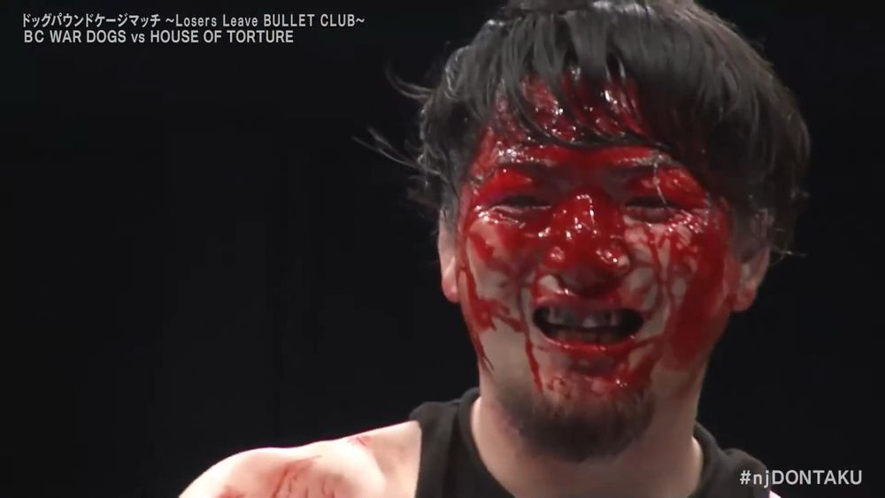 closeup on a smiling Ren Narita, his entire face covered in blood
