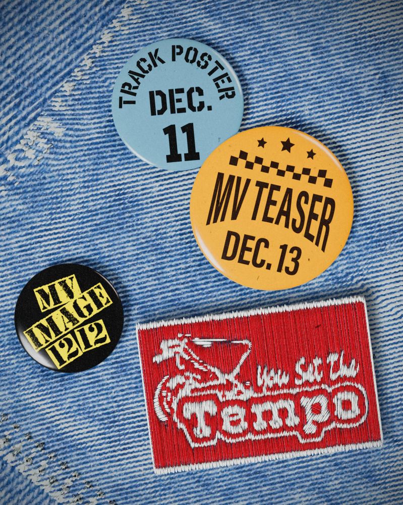 A blue jean jacket featuring a patch andnsome buttons, representing SHINee Minho's single schedule.