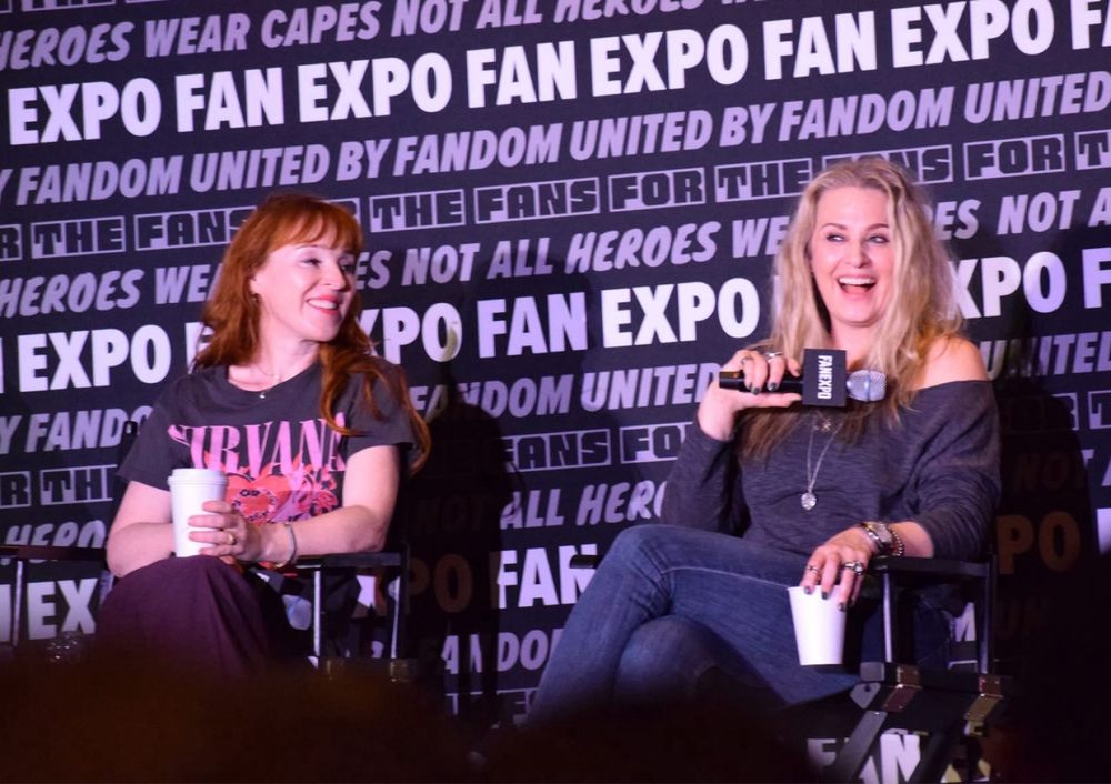 Ruth Connell and Samantha Smith on stage for Supernatural panel.