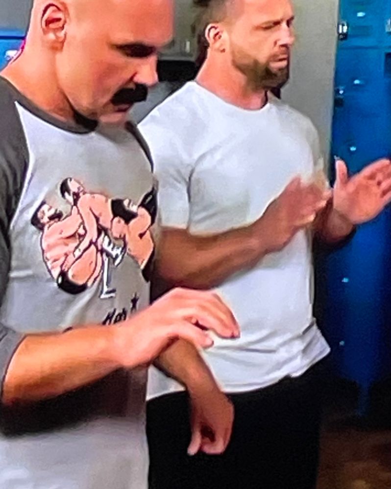 Dax and Cash of FTR wondering why all the non-wrestling fans seeing Dax’s Shatter Machine shirt are blushing 