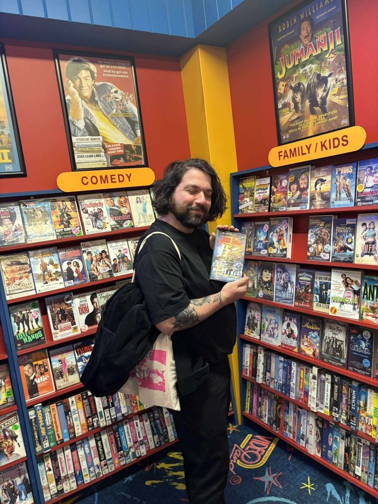 Holding one of my favourite movies to rent as a kid Mighty Ducks