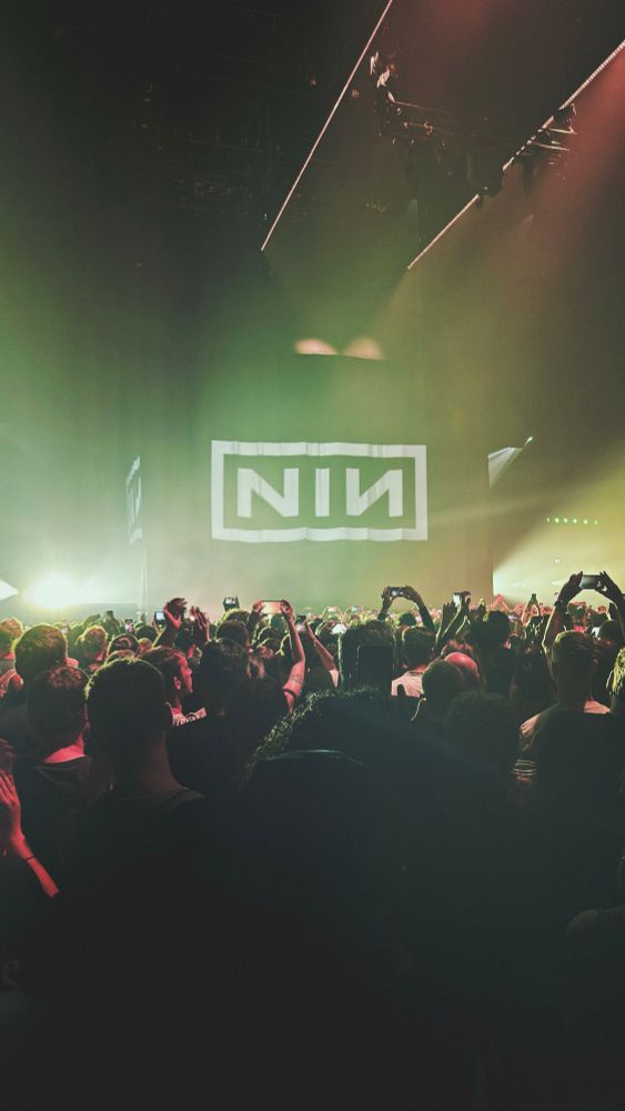 The end of an epic NIN concert in Amsterdam showing the crowd and their logo
