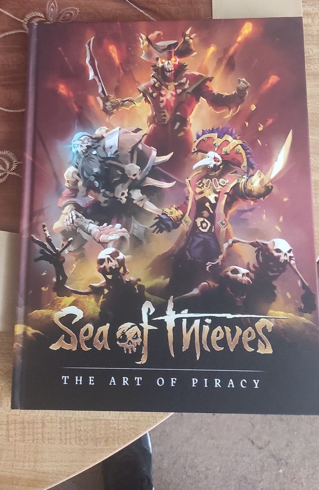 Three fabled Skeleton Lords alongside minion skeletons present themselves on the explosive cover of the newest tome "Sea Of Thieves: The Art of Piracy"