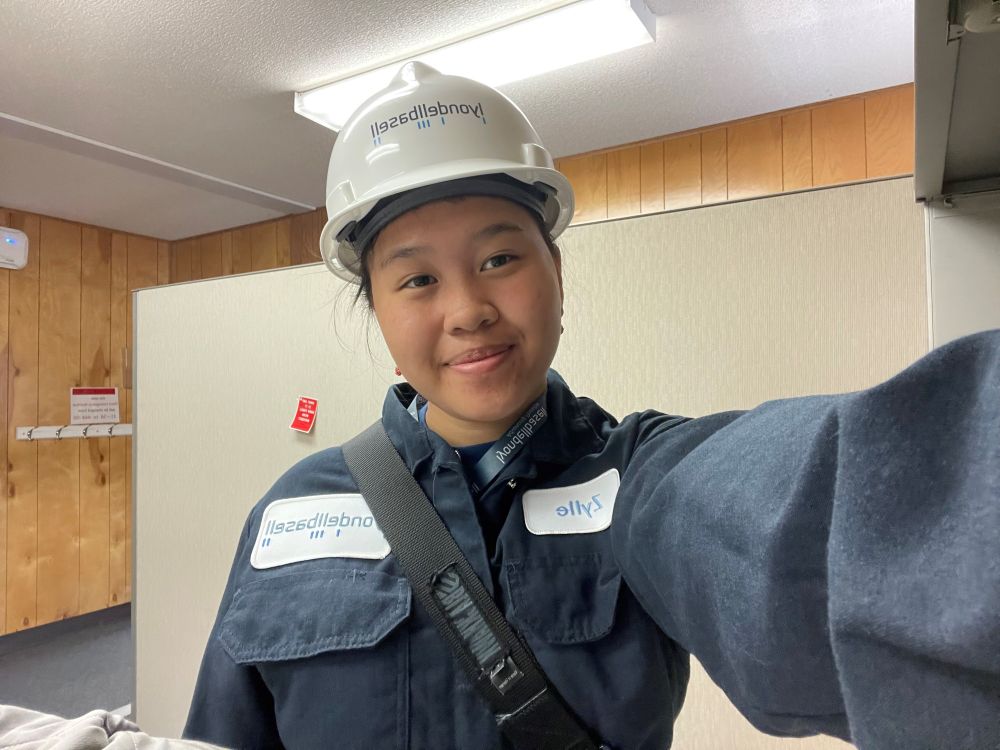 Selfie of Zylle Constantino in her Lyndon baseball hard hat and workwear jumpsuit. 