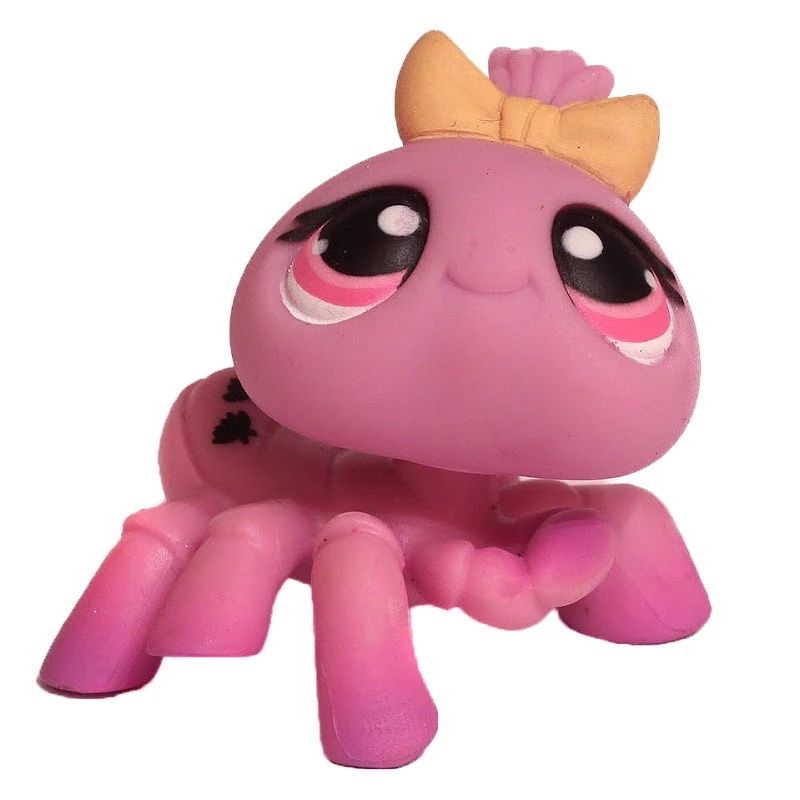 littlest pet shop figure #430, a pinkish lilac spider wearing a bow