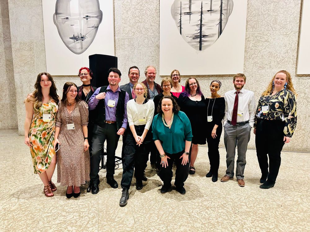Group photo of the organizing committee and student volunteers of the 2025 CAC meeting. All posed in front of a grey Tyndall stone wall.