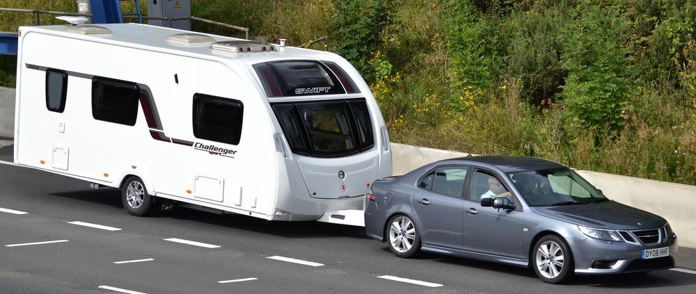 NG SAAB 9-3 towing a “Swift Challenger” branded camper trailer 