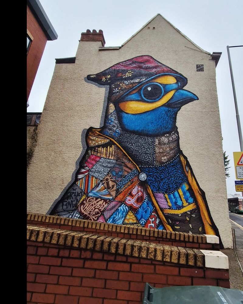 A large mural of a brightly coloured bird.