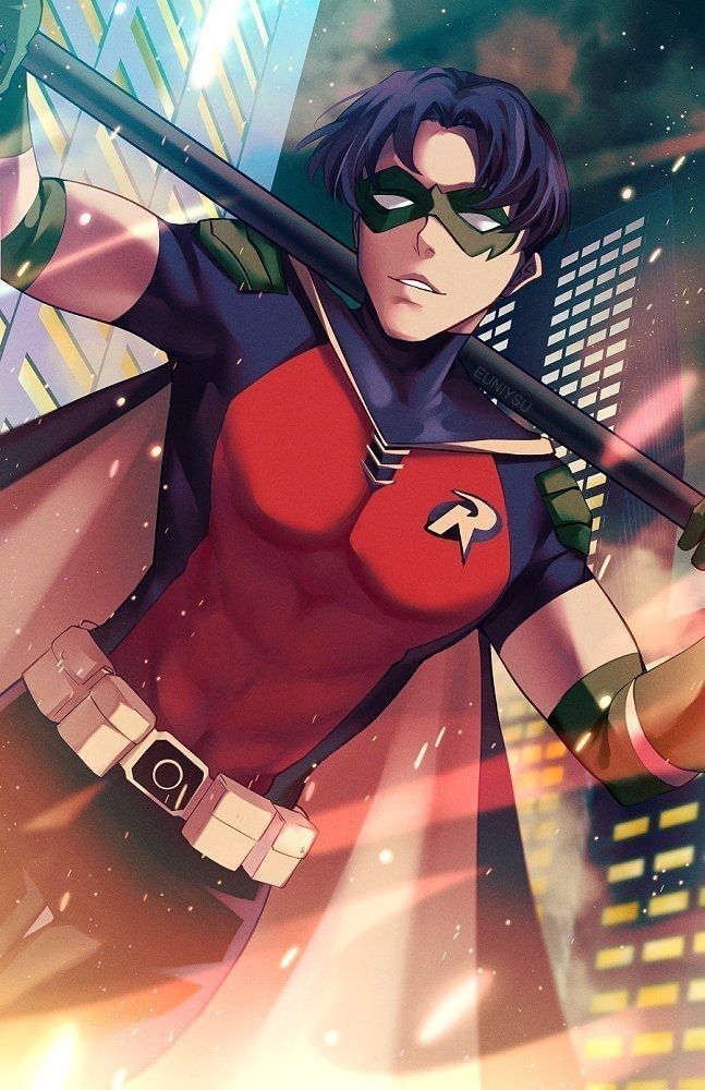 Tim drake in robin gear with his bo staff across his shoulders. He is looking at the viewer and surrounded by orange and white light with contrasting blue/green buildings of gotham.