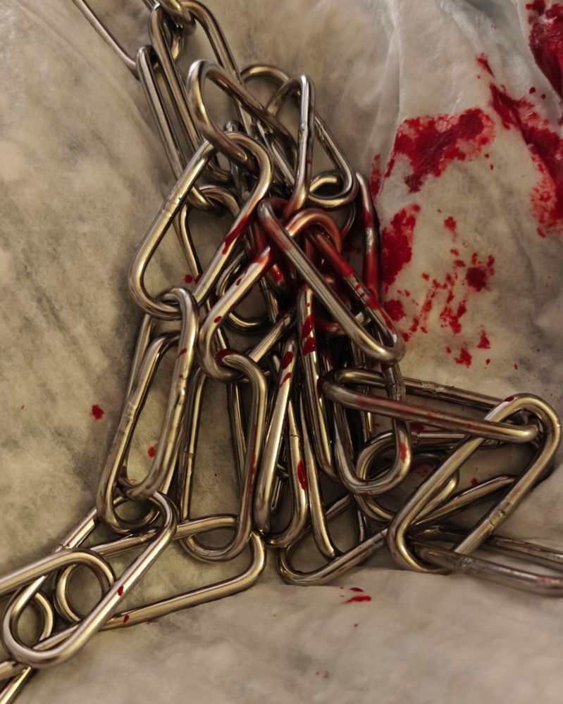 Blood dripped onto chains on an absorbent pad