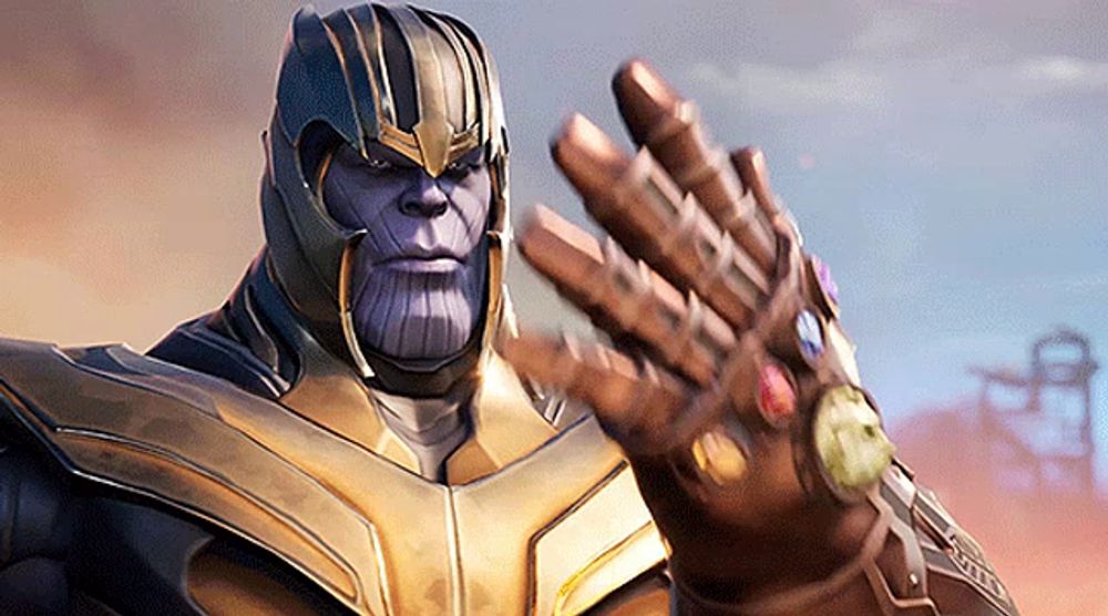 thanos is wearing a helmet and holding his infinity gauntlet in his hand