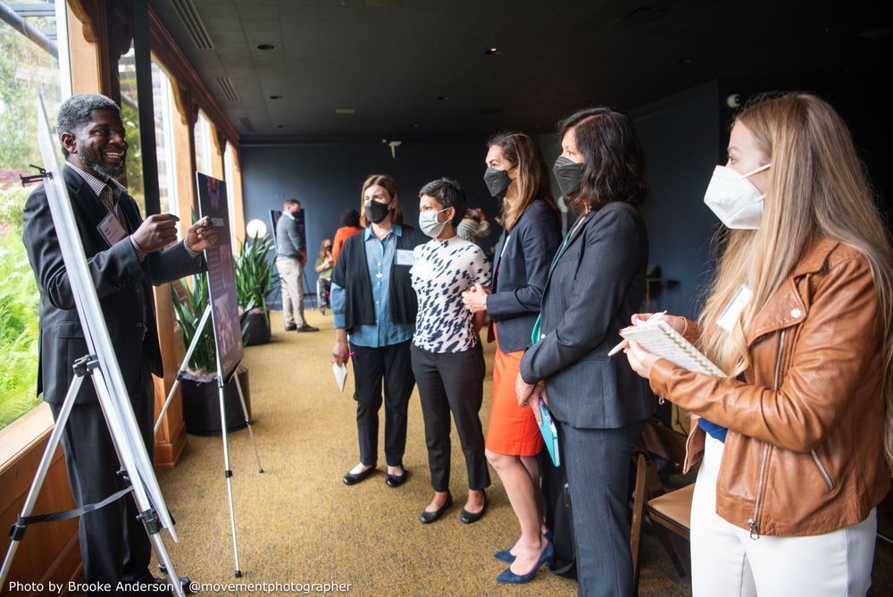 Jamie Frazier speaks to five attendees about Lighthouse Foundation of Chicagoland during the 2025 Presidents’ Council meeting grantee reflections.