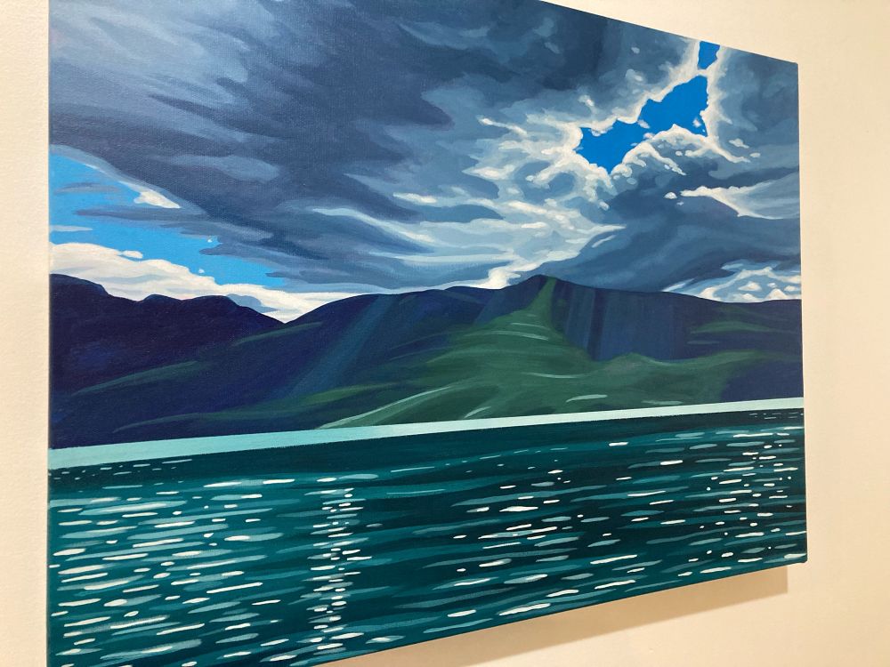 Kootenay Lake, mountains and an unsettled sky. 