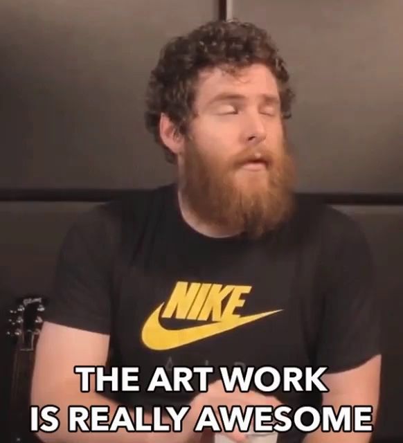 a man with a beard wearing a nike shirt