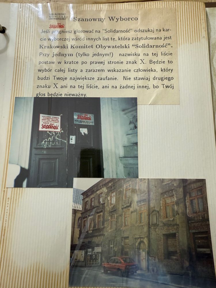 A scrapbook page (!) with at the top a Krakow Citizens Committee notice to voters, in Polish, explaining how to correctly vote.

Next a picture of a double door with signs for Solidarity’s national commission of pensioners and disabilities, as well as Solidarity’s Mazovia Regional Office.

Thirdly, at bottom, a picture of an old 3-story building, presumably in Krakow, with a red four door car out front. 