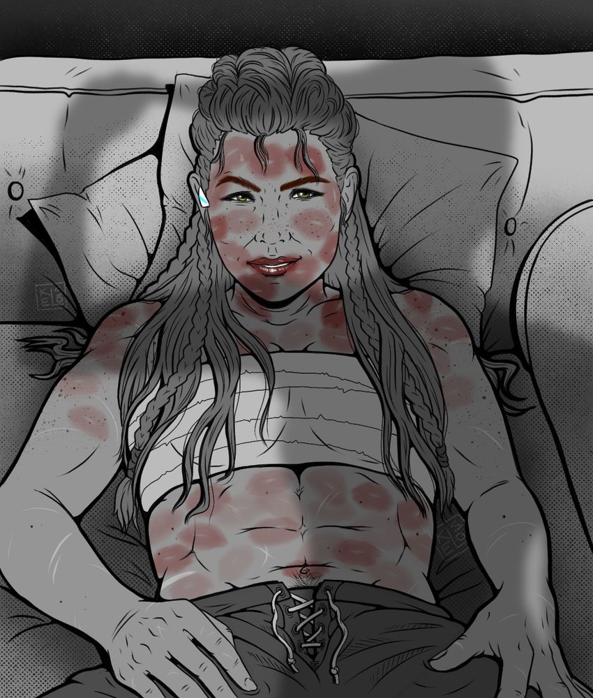 Aloy reclined back with a smirk on her face and covered in lipstick kisses while talanah casts a shadow standing in front of her taking her hair down