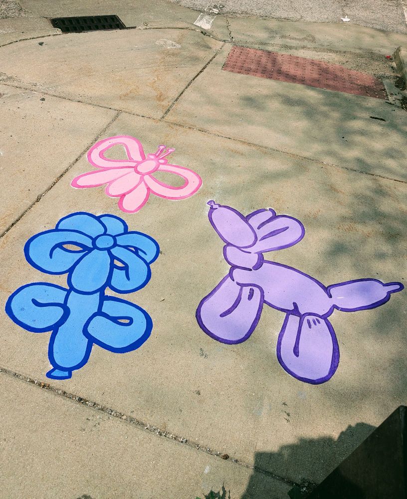 Photo of sidewalk mural of balloon animals 