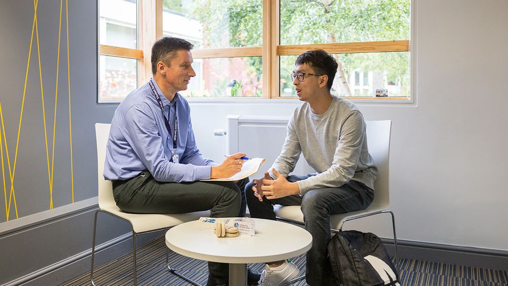 Two people talking in a counselling session 