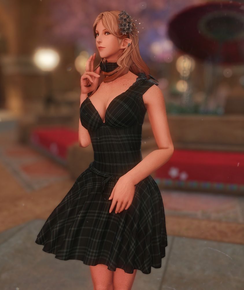 A gpose of Annie (an elezen woman) in a green and black tartan A-line dress with gray flowers in her hair. She's got a small but confident smile. 
