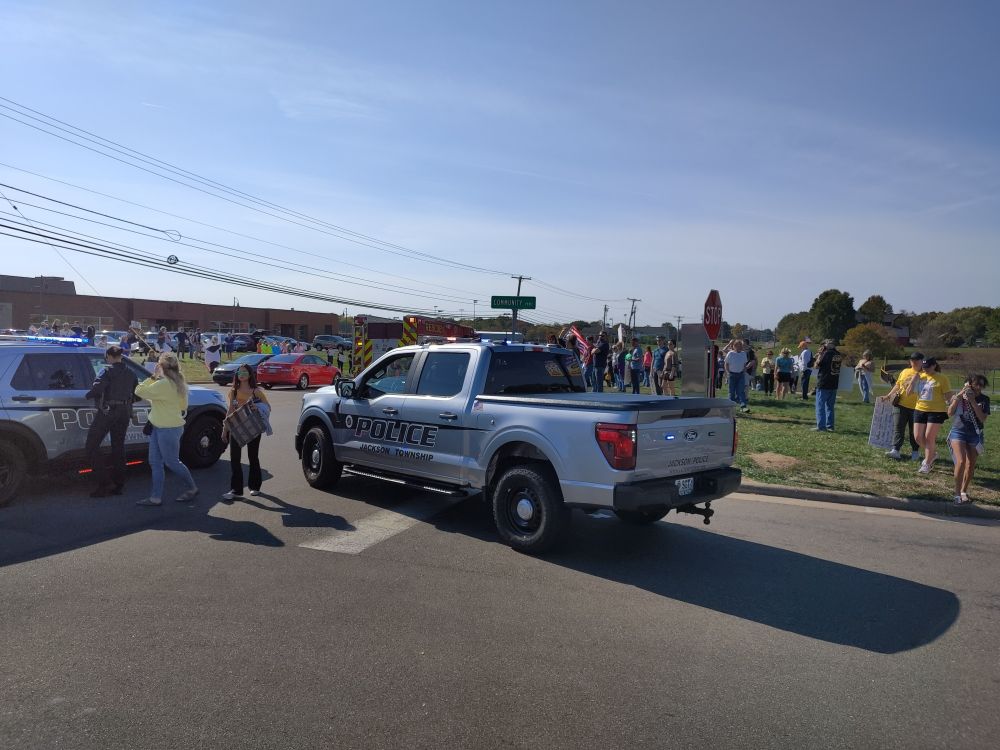 Police and EMS on scene where vehicle struck a protester.