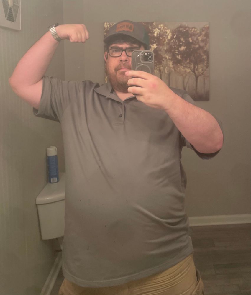 A dingus flexing in the mirror dingusly 