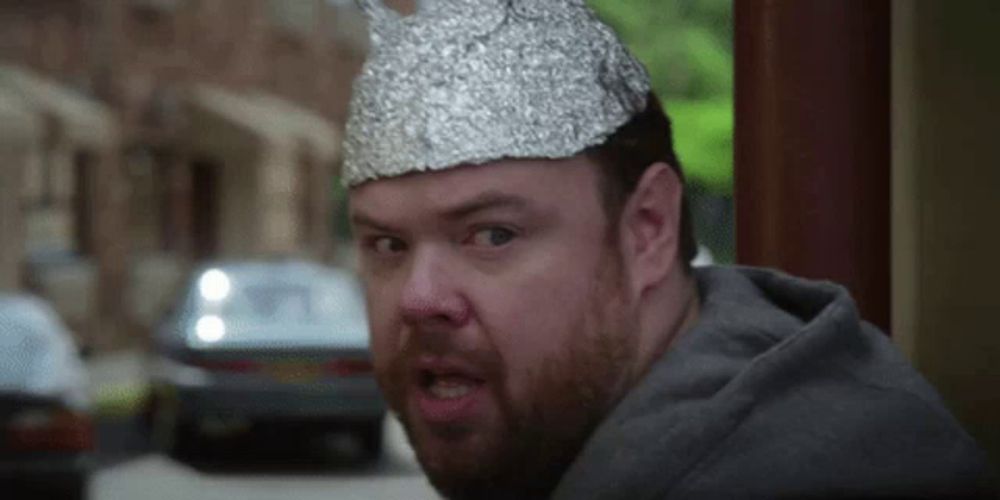 a man with a tin foil hat on his head