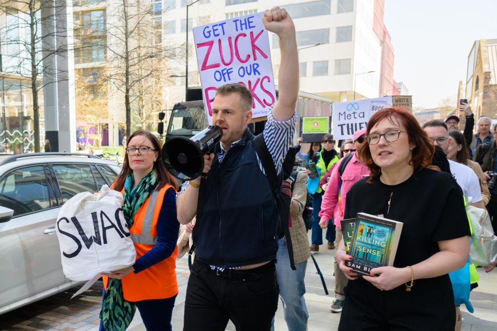 Author AJ West led the protesters with SoA CEO Anna Ganley carrying a swag bag containing authors words to deliver to Meta