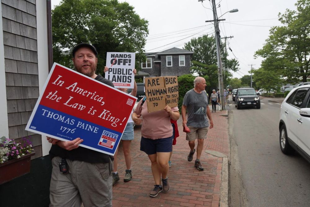 marching with no kings sign nantucket