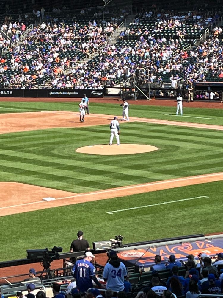 Grainy far away photo of players at Citi Field 